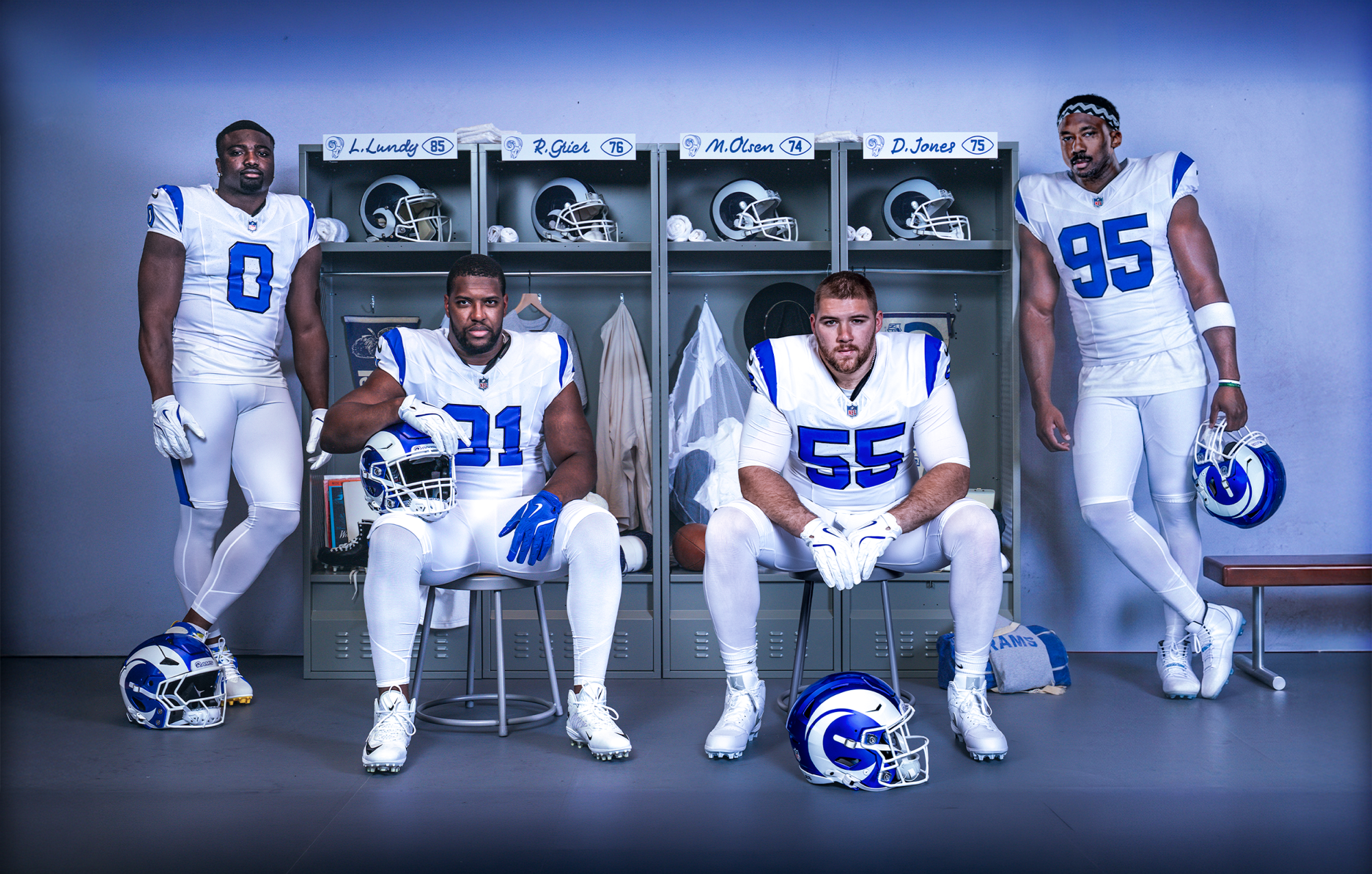 Rams players Byron Young, Kobie Turner, Braden Fiske and Myles Garrett show off the Rams' new "Fearsome White" uniforms.