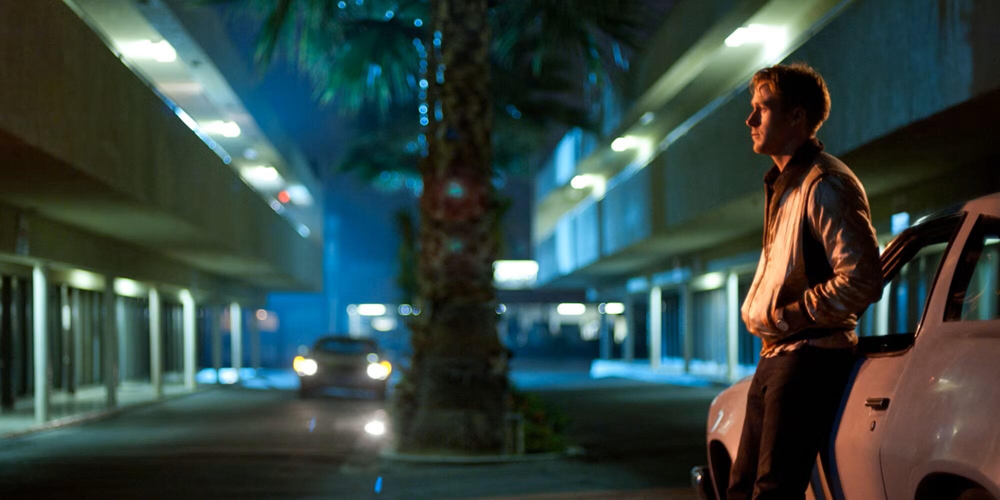 A man leans against his car on a Los Angeles night.