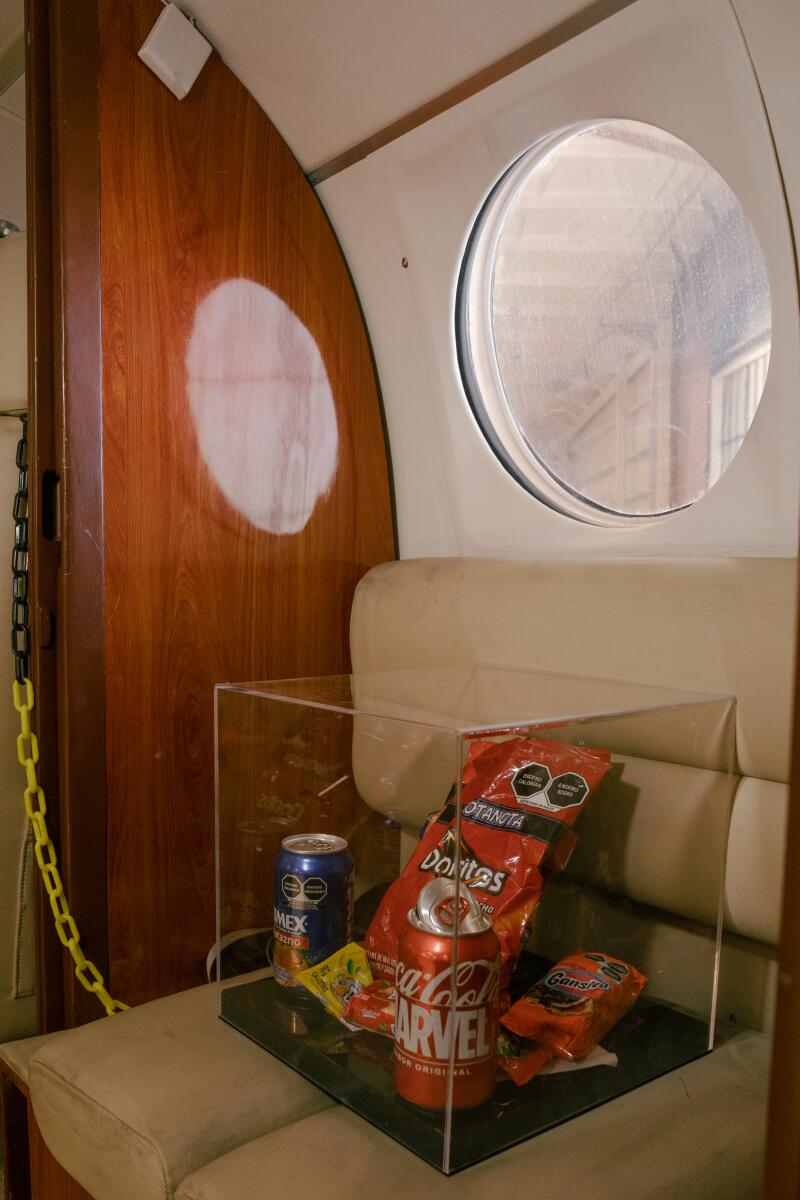 Mexican snacks are displayed inside of a Beechcraft King Air aircraft.