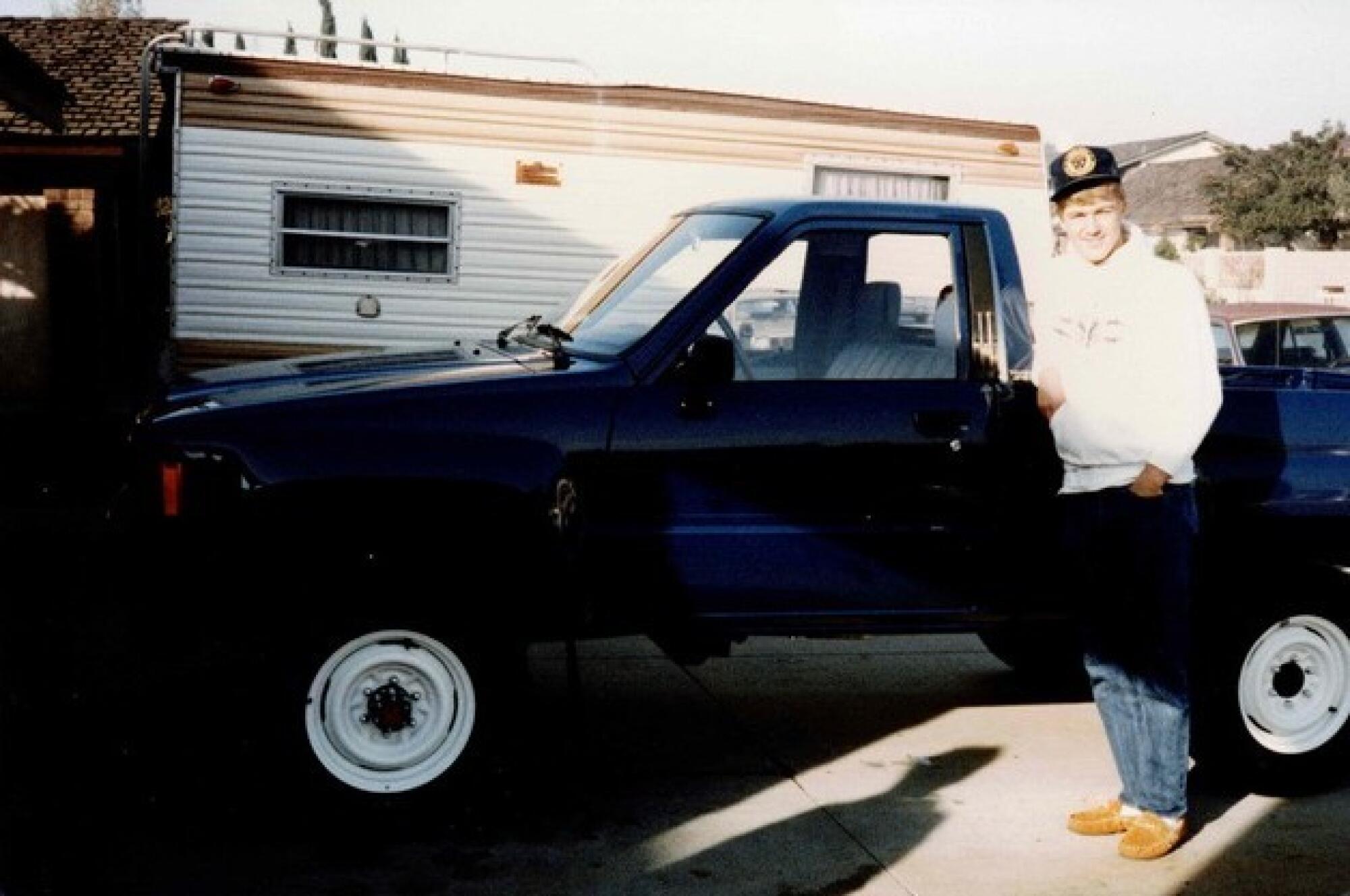 Jeff Kent stands beside the Toyota 4x4 pickup truck his parents gave him in 1985.