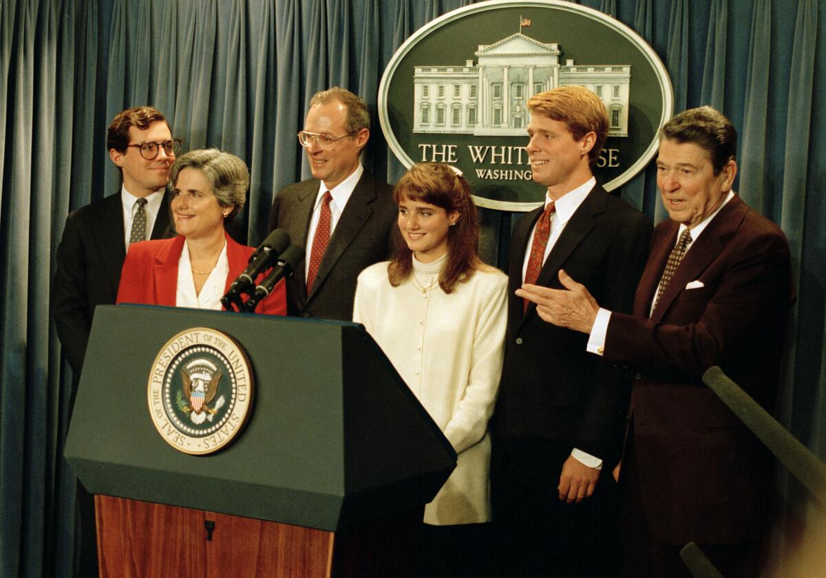 President Reagan gestures toward Judge Anthony M. Kennedy's family after nominating Kennedy to the Supreme Court in 1987.