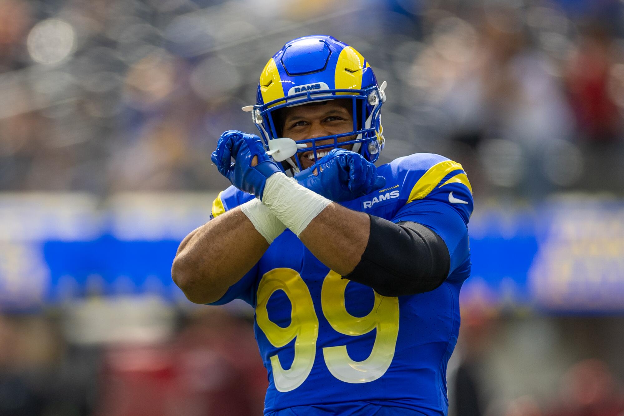 Rams defensive tackle Aaron Donald gestures to fans before a game against the Arizona Cardinals.