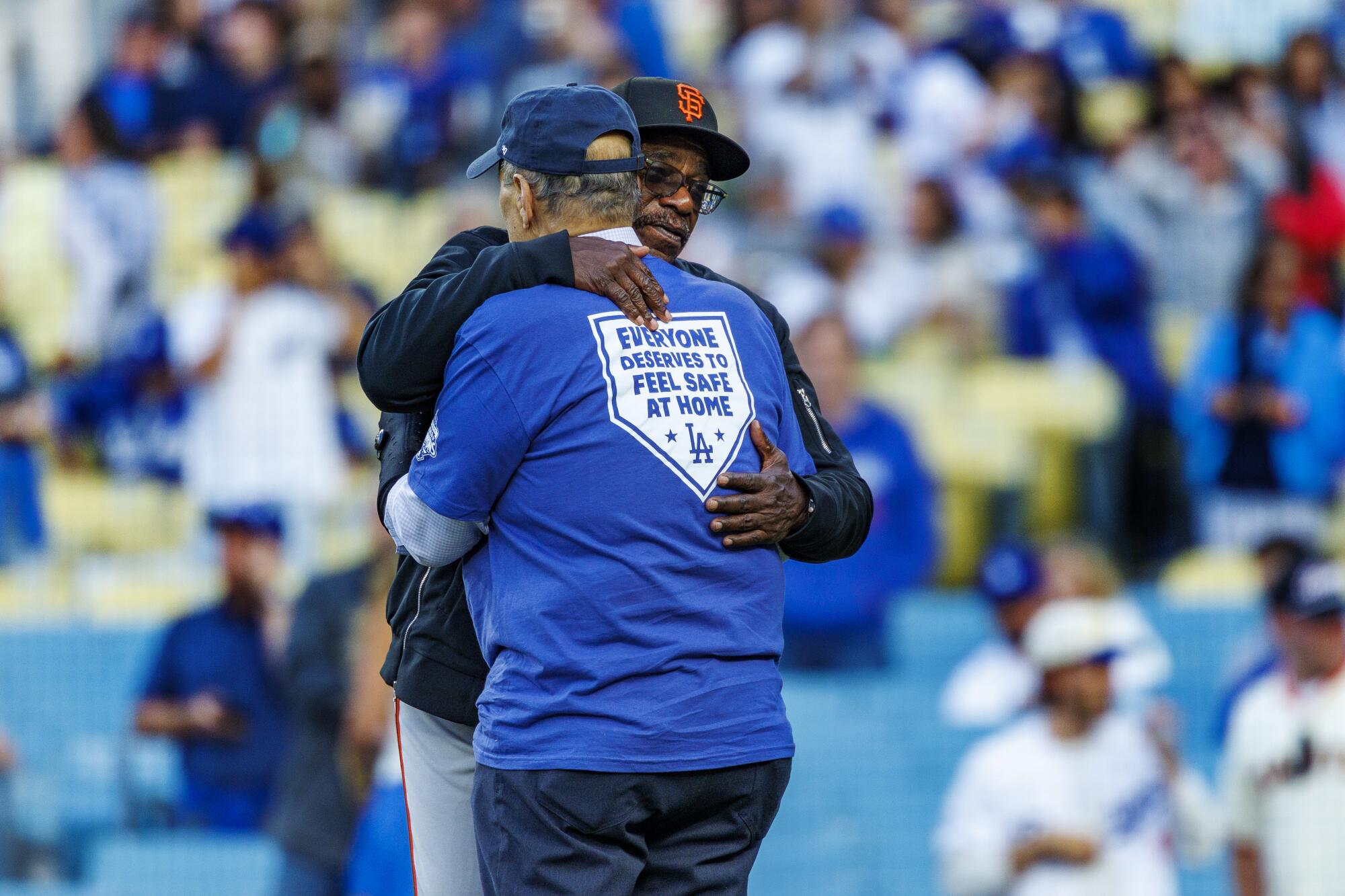 San Francisco Giants assistant manager Ron Washington hugs Joe Torre before a game at Dodger Stadium on May 14.