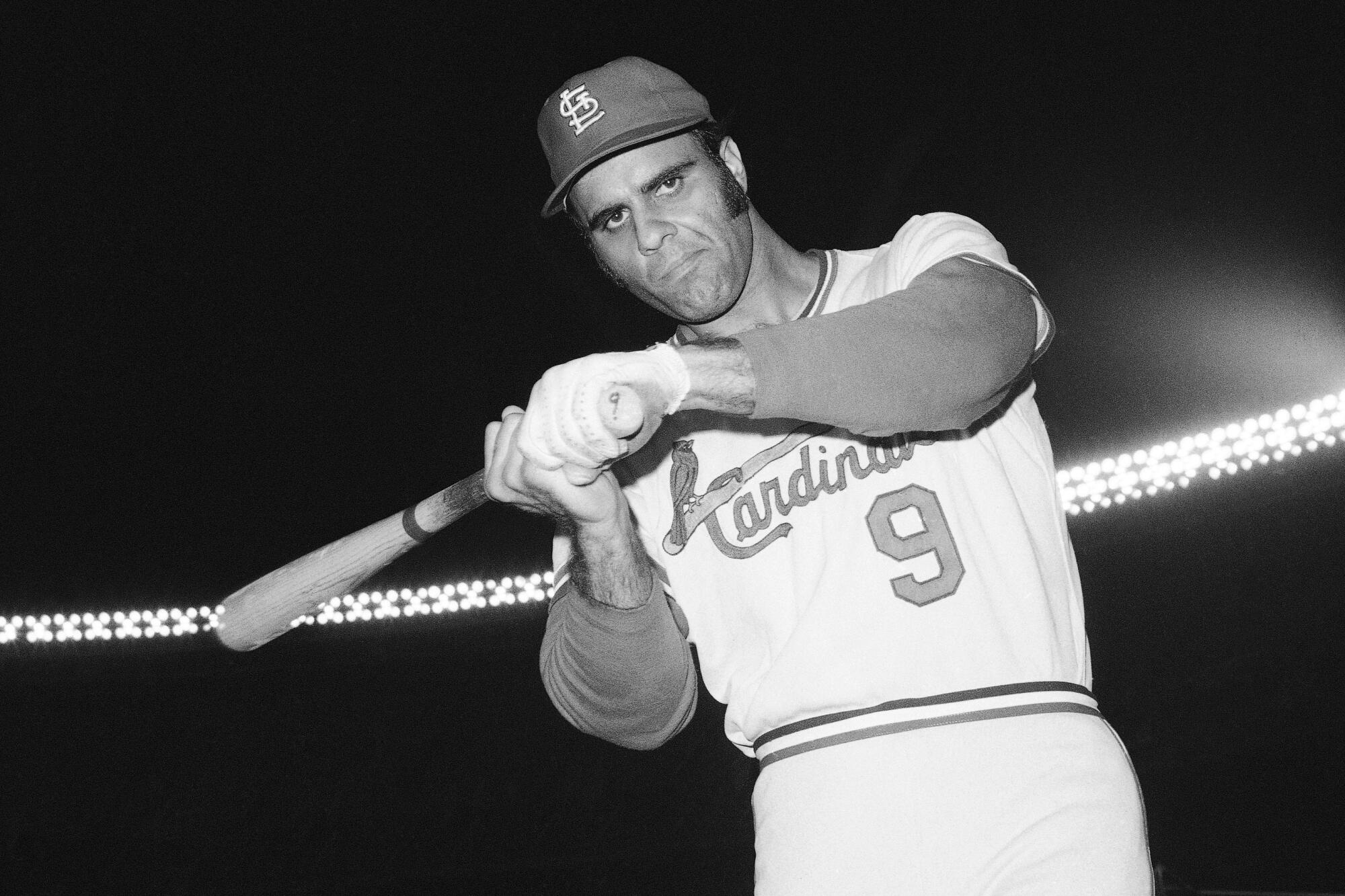 St. Louis Cardinals third baseman Joe Torre poses swinging a bat prior to a game in 1971. 