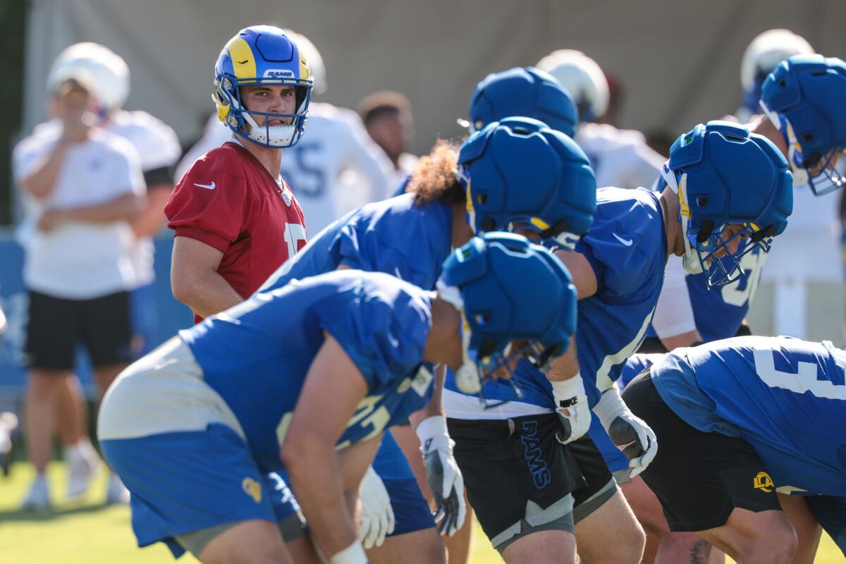 Rams quarterback Ty Simpson prepares to take a snap in training camp at Loyola Marymount on Sunday.