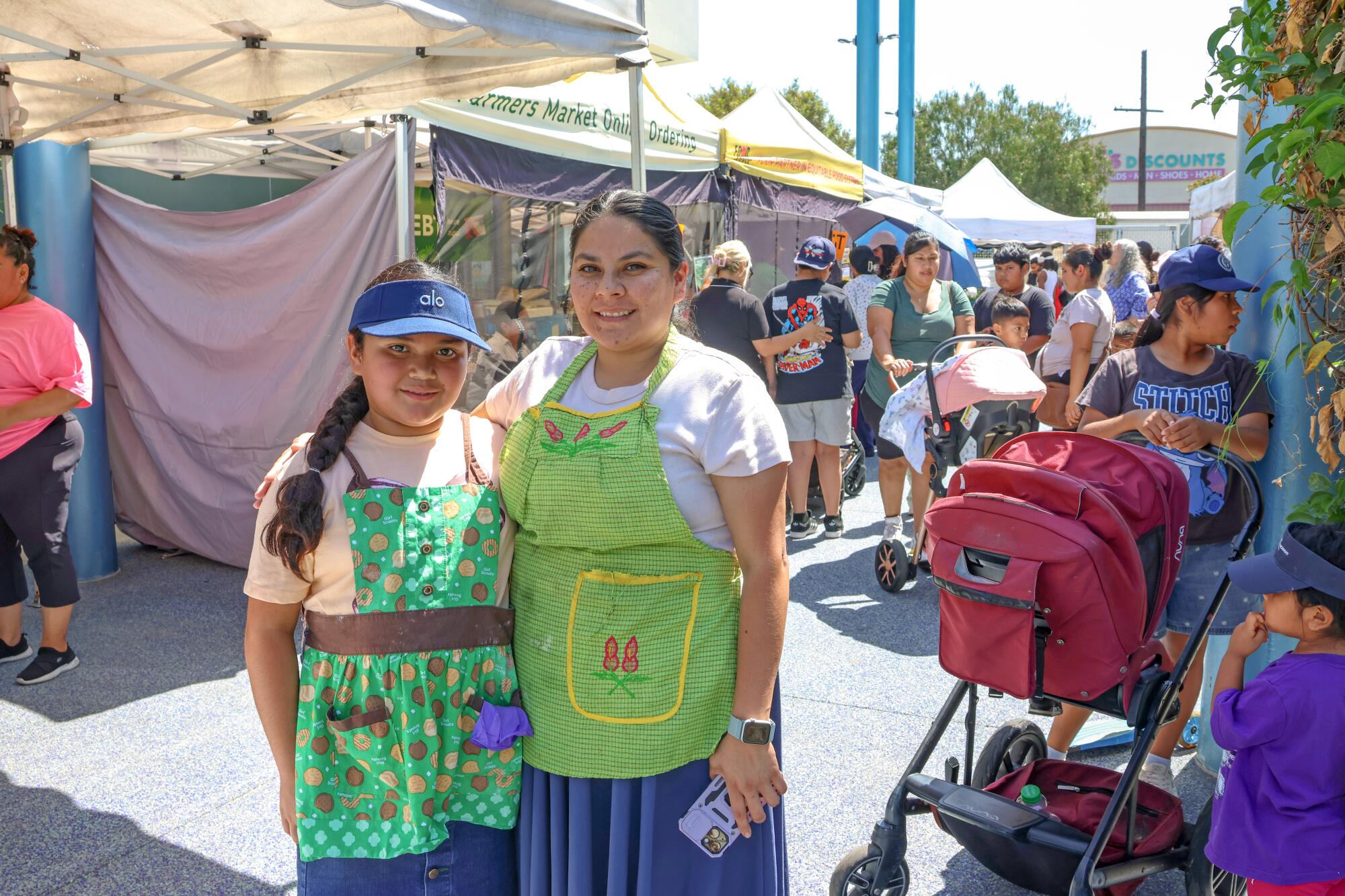 Yoana Luvian with her daughter, Sarahi, at the Central Avenue Farmers Market