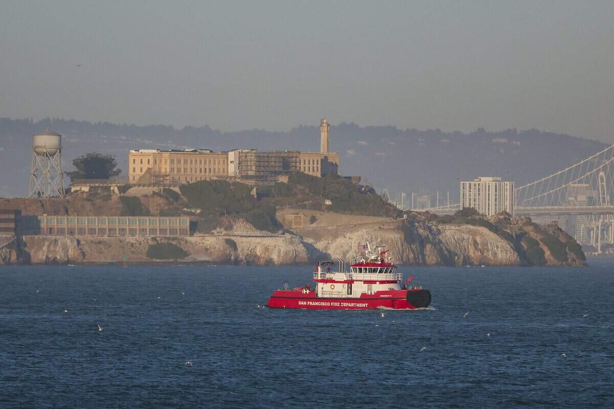 A San Francisco Fire Department boat searches near Alcatraz for two missing individuals after a boat capsized Tuesday, July 14, 2026 in San Francisco.