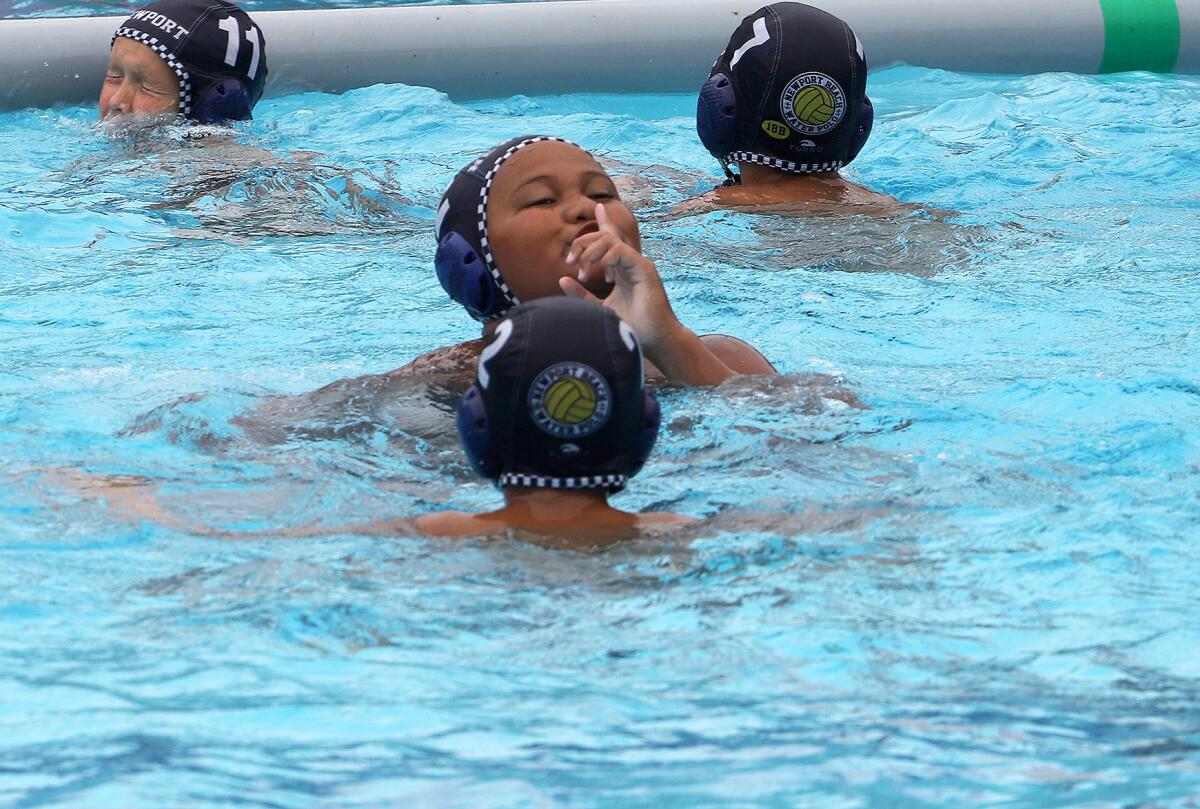 Newport Beach's Fa'amika Moala (12) celebrates with his team against 908 on Sunday.