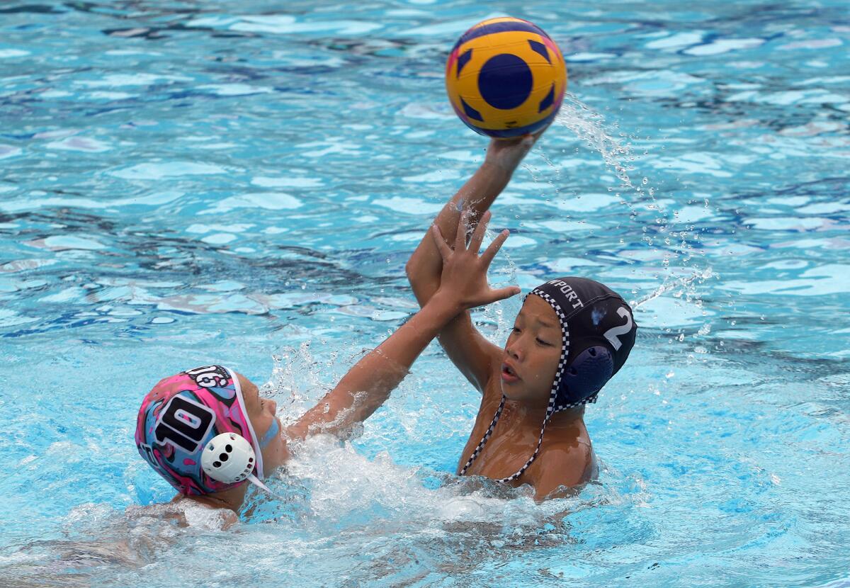 Newport Beach's Ethan Tran (2) makes a pass against 908 at the USA Water Polo Junior Olympics on Sunday.