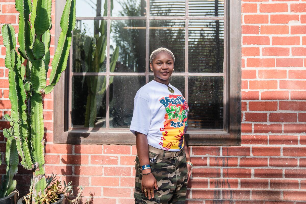 Audrey Ohwobete, 21, poses for a photo at the Beehive in South Los Angeles.