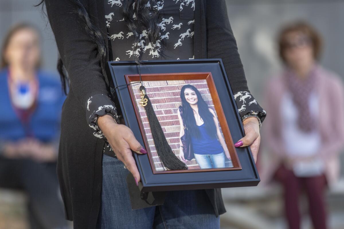 Erica Porteous speaks about her slain sister, Yvette Velasco, at a memorial at Cal State San Bernardino on Dec. 2, 2019.