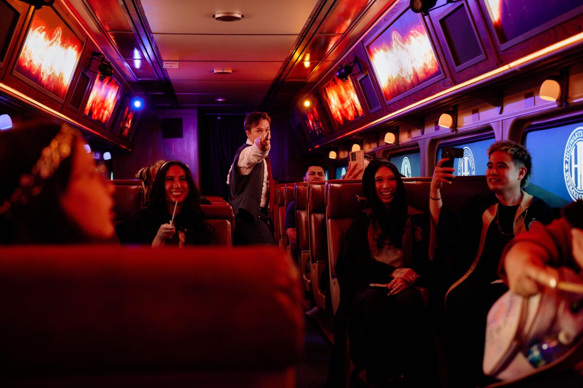 The cast performs with magic wands on the Hogwarts Train Experience in Perris, Calif.