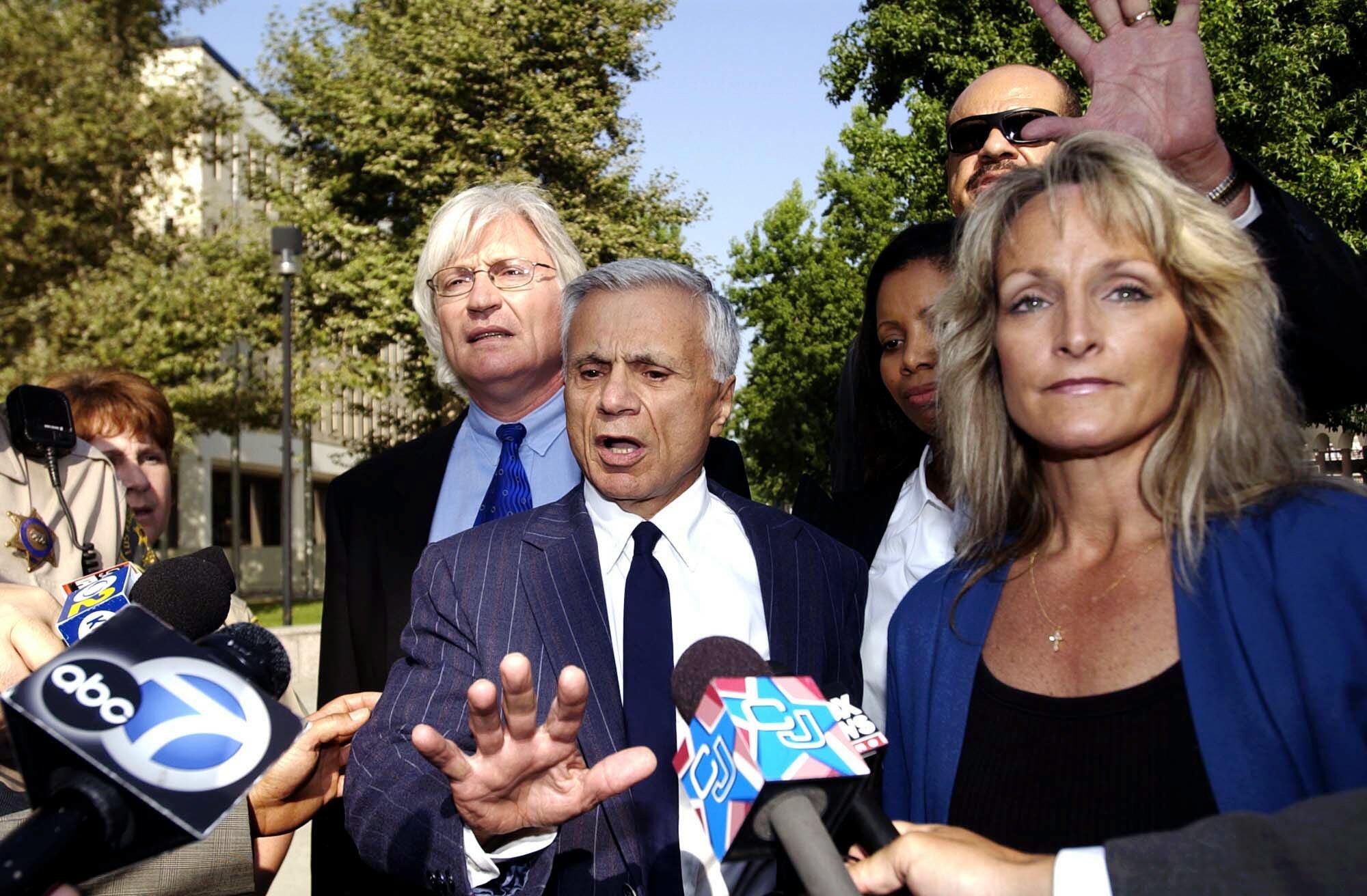 Actor Robert Blake, center, with his attorney Thomas Mesereau Jr, on July 10, 2003, in Los Angeles.