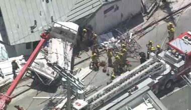 Firefighters rescue trapped driver after flatbed truck slams into building in Pacific Palisades