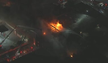 Large fire erupts at business in Harbor Gateway, filling the air with black smoke