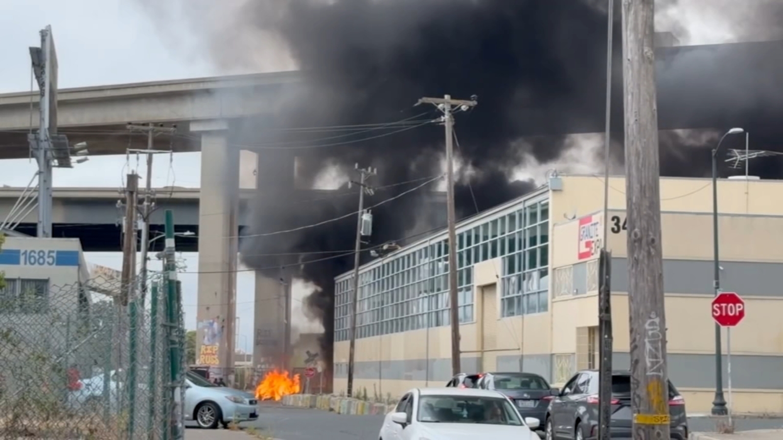 Crews battle fire, near Interstate 580 in Oakland