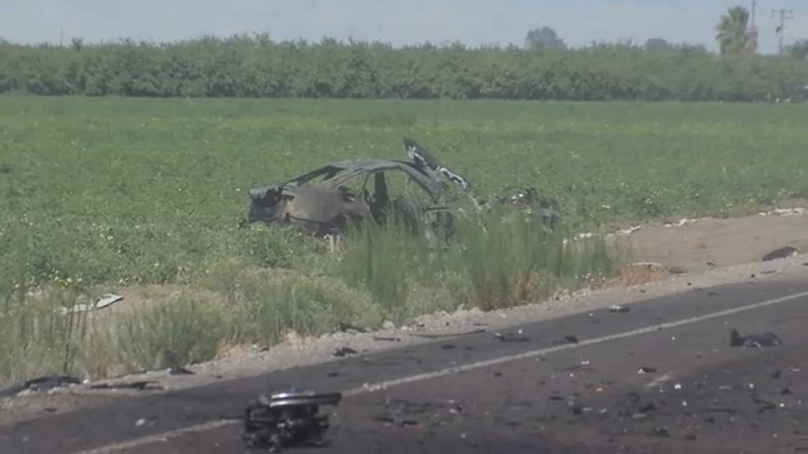 1 person killed, another hospitalized after car crashes into tractor in Fresno County