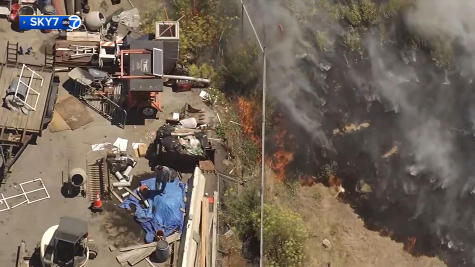 Crews respond to grass fire in San Francisco Hunter's Point neighborhood at Quesada Avenue and Fitch Street