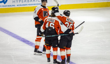 Philadelphia Flyers defenseman Travis Sanheim (6), center Trevor Zegras (46), and right wing Matvei Michkov (39) meet at center ice against the Nashville Predators at the Xfinity Mobile Arena.