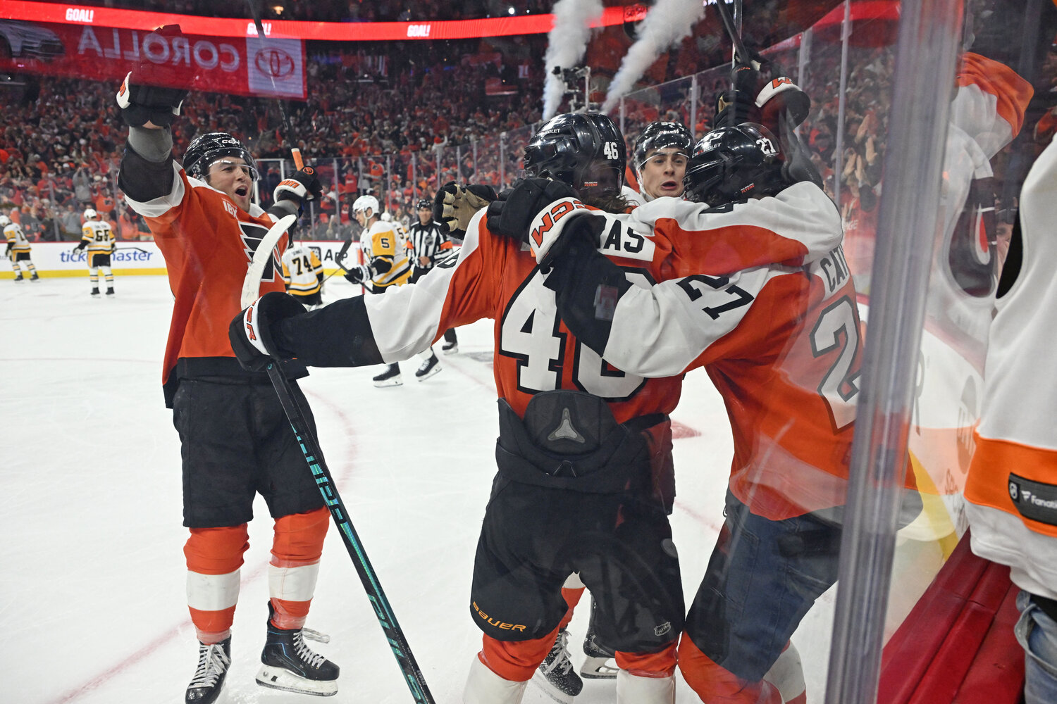 Apr 22, 2026; Philadelphia, Pennsylvania, USA; Philadelphia Flyers left wing Noah Cates (27) celebrates his goal with right wing Tyson Foerster (71), center Trevor Zegras (46) and right wing Porter Martone (94) against the Pittsburgh Penguins during the third period in game three of the first round of the 2026 Stanley Cup Playoffs at Xfinity Mobile Arena.