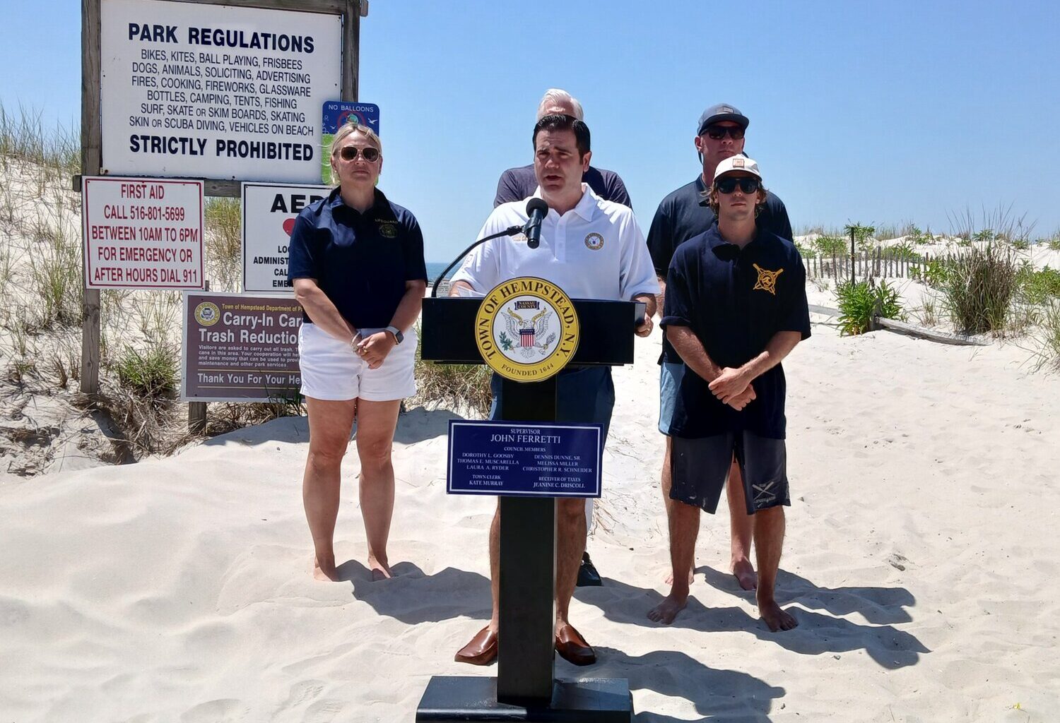 Town of Hempstead Supervisor John Ferretti, center, held a news conference discussing the day
