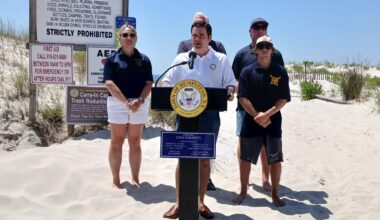 Town of Hempstead Supervisor John Ferretti, center, held a news conference discussing the day
