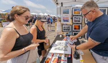 Diane Nystrom from Oceanside, left, and Stephanie Williams, of Long Beach, bought artwork from Scott Ferrone during last year&rsquo;s boardwalk fair.