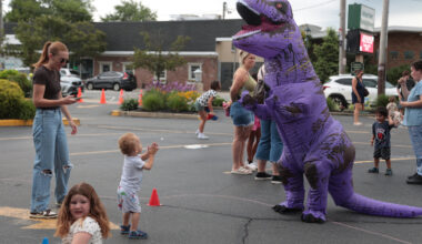 2-year-old Nikolas Jackson met a T-Rex at the family-friendly "contest" between Island Park and Long Beach libraries.