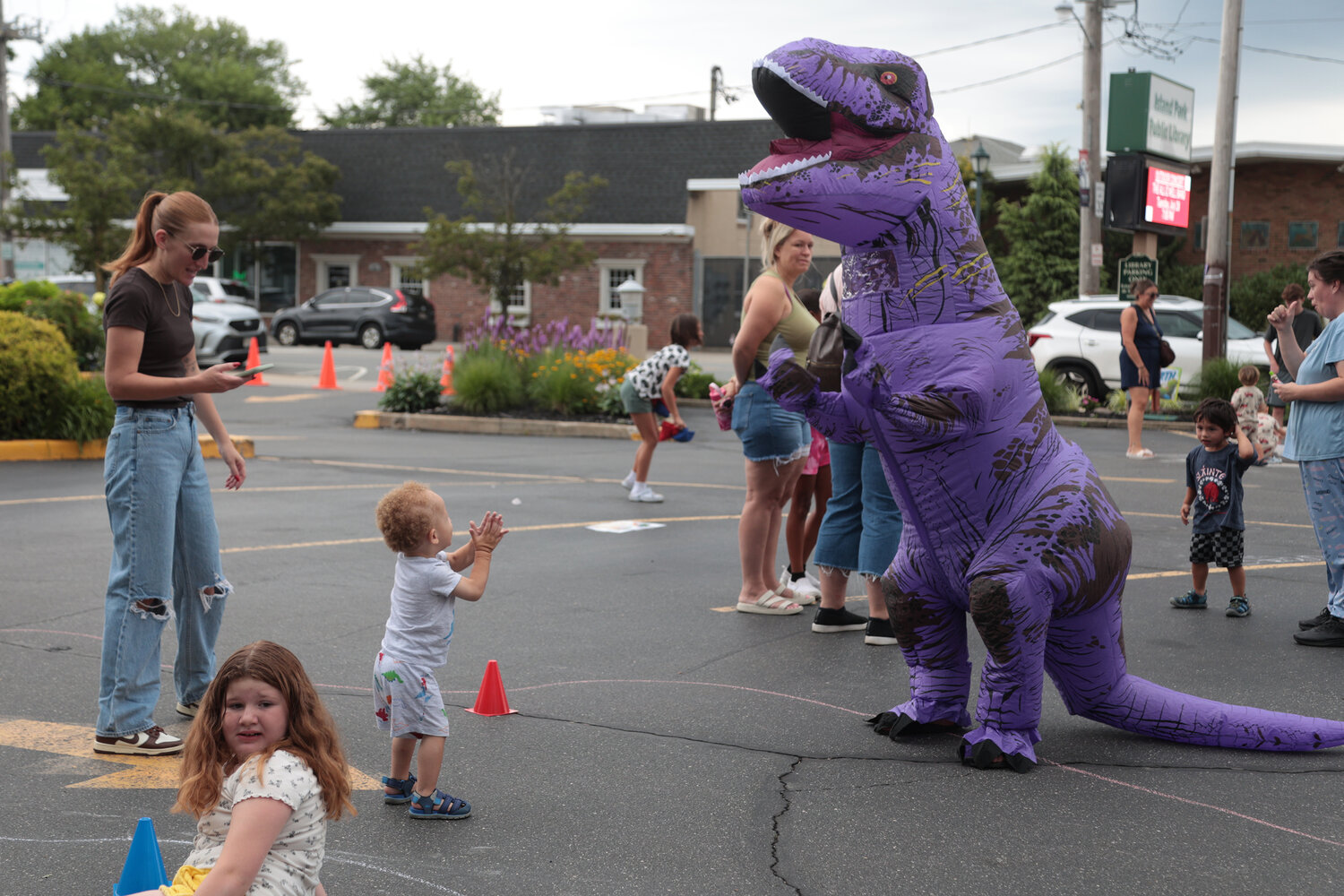 2-year-old Nikolas Jackson met a T-Rex at the family-friendly "contest" between Island Park and Long Beach libraries.