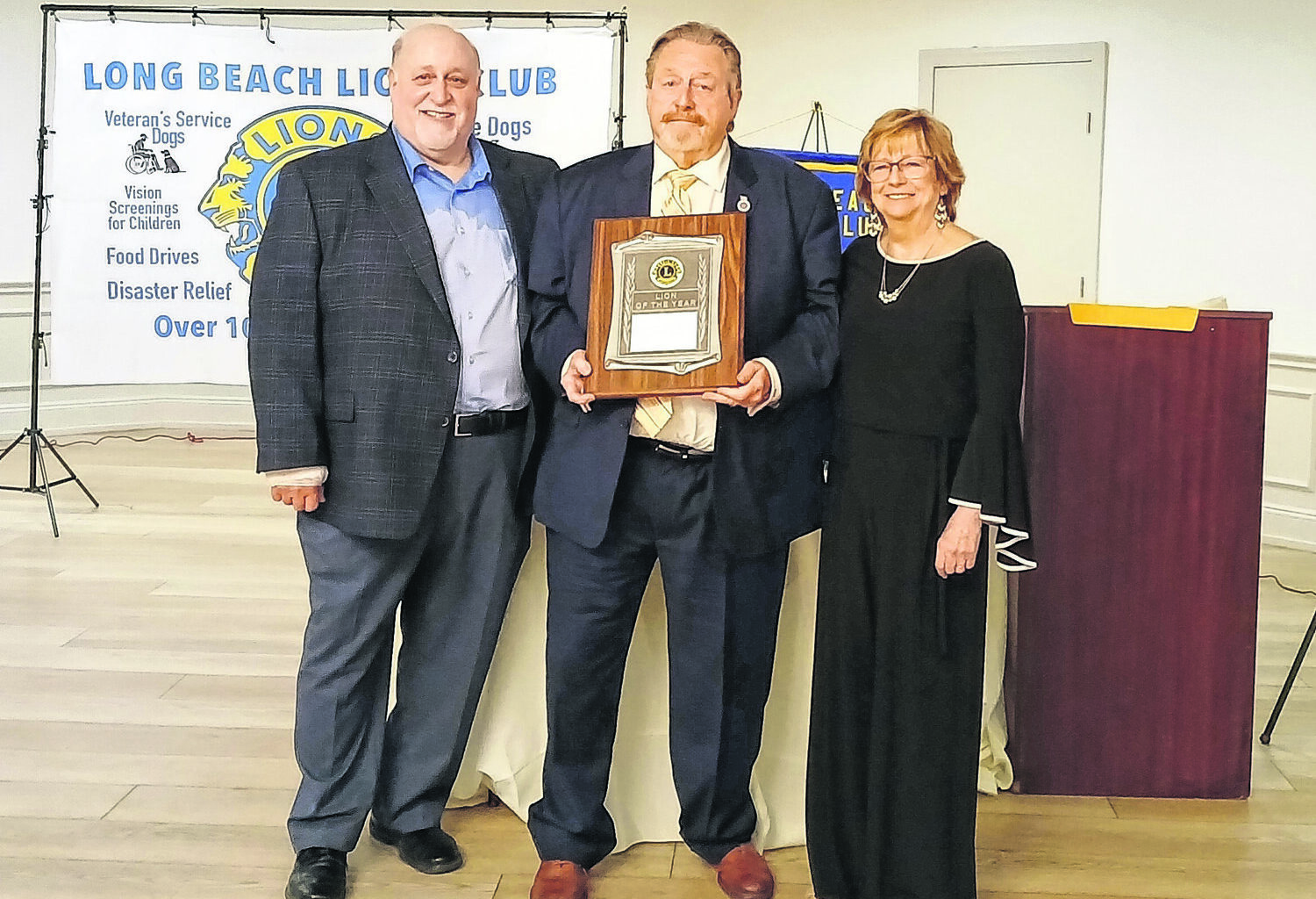 Lions Club President Allen Schwartz, left, presented Island Park Mayor Mike McGinty and his wife, Jeanne, with the Lion of the Year award for their unwavering support of Lions activities.