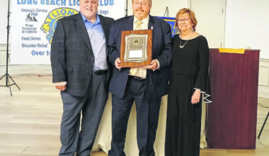 Lions Club President Allen Schwartz, left, presented Island Park Mayor Mike McGinty and his wife, Jeanne, with the Lion of the Year award for their unwavering support of Lions activities.