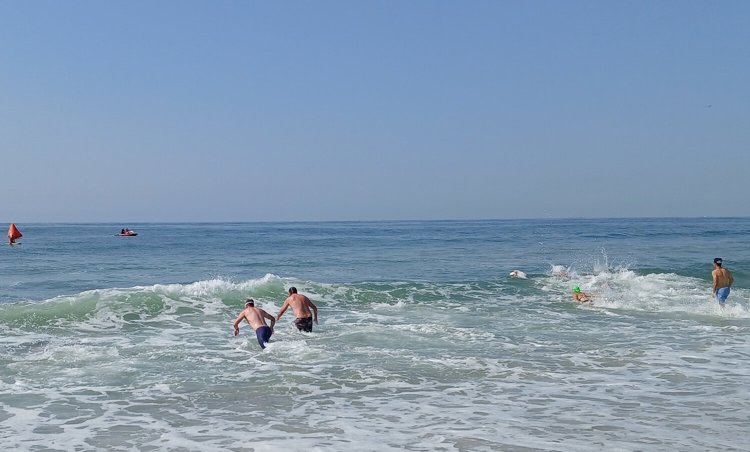 The team relay segment began with a 400-yard ocean swim. After the swim, a half-mile paddleboard leg led to the final mile-and-a-half-long run along the beach.