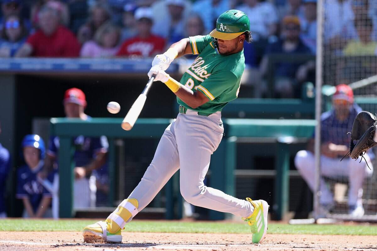 Leo De Vries of the Athletics bats against the Texas Rangers during the second inning of the spring training game at Surprise Stadium on March 12, in Surprise, Arizona. De Vries is one of the A’s players competing in the All-Star Futures Game on Sunday.