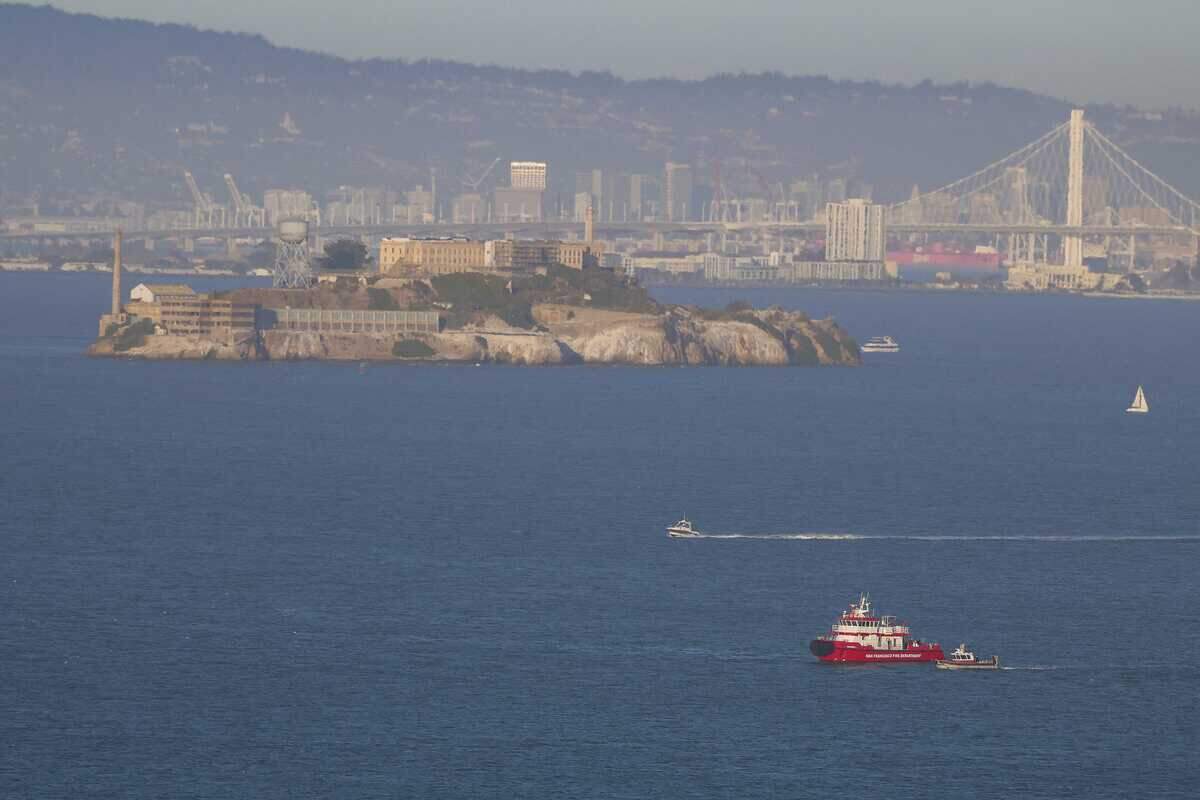 A San Francisco Fire Department boat searches the waters west of Alcatraz on Tuesday, July 14, 2026, after the vessel Volare sinks. Authorities said investigators believed there was a strong possibility that some passengers were trapped inside a cabin when the boat went under.