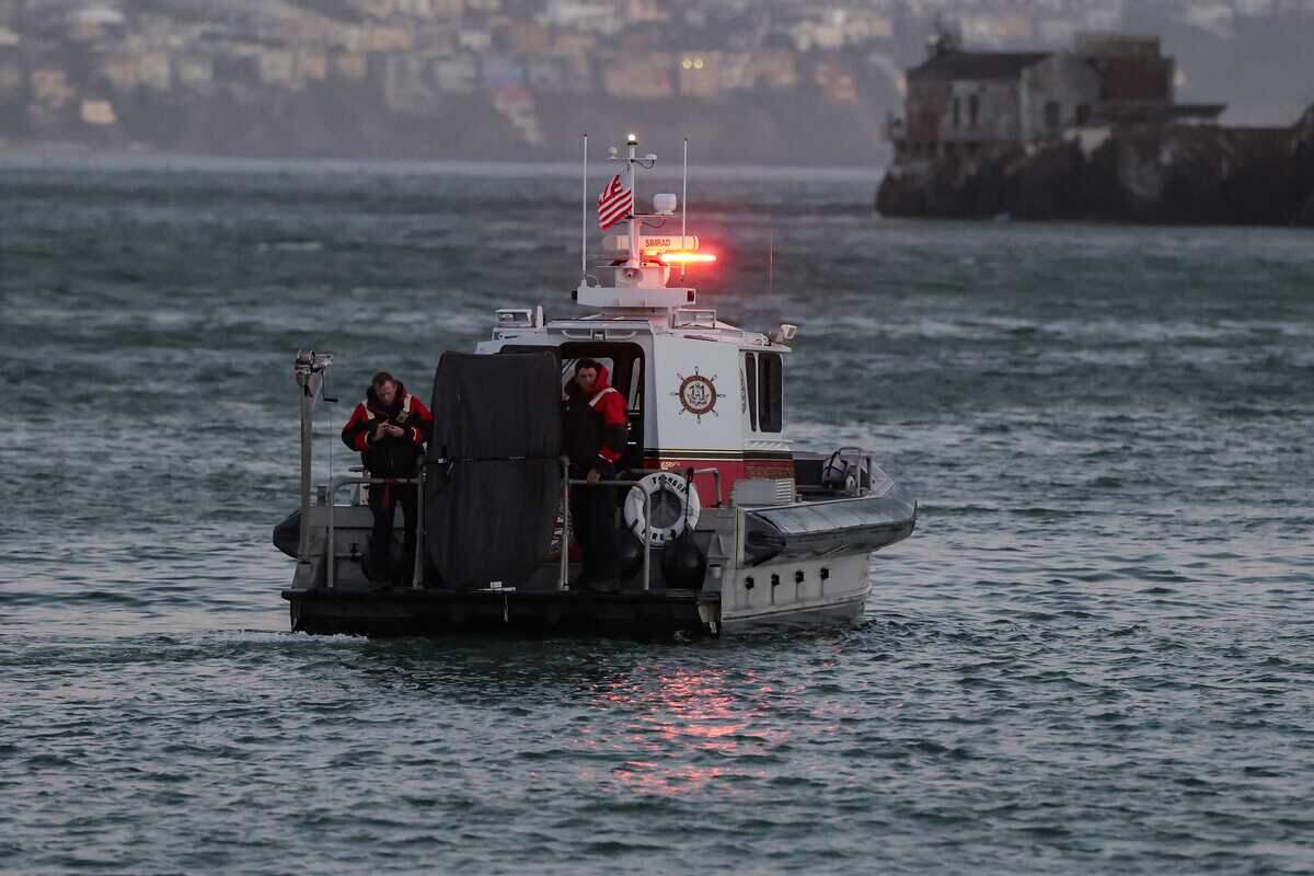 A San Francisco Fire Department boat searches the waters west of Alcatraz on Tuesday, July 14, 2026, after the vessel Volare sinks. Authorities said investigators believed there was a strong possibility that some passengers were trapped inside a cabin when the boat went under.