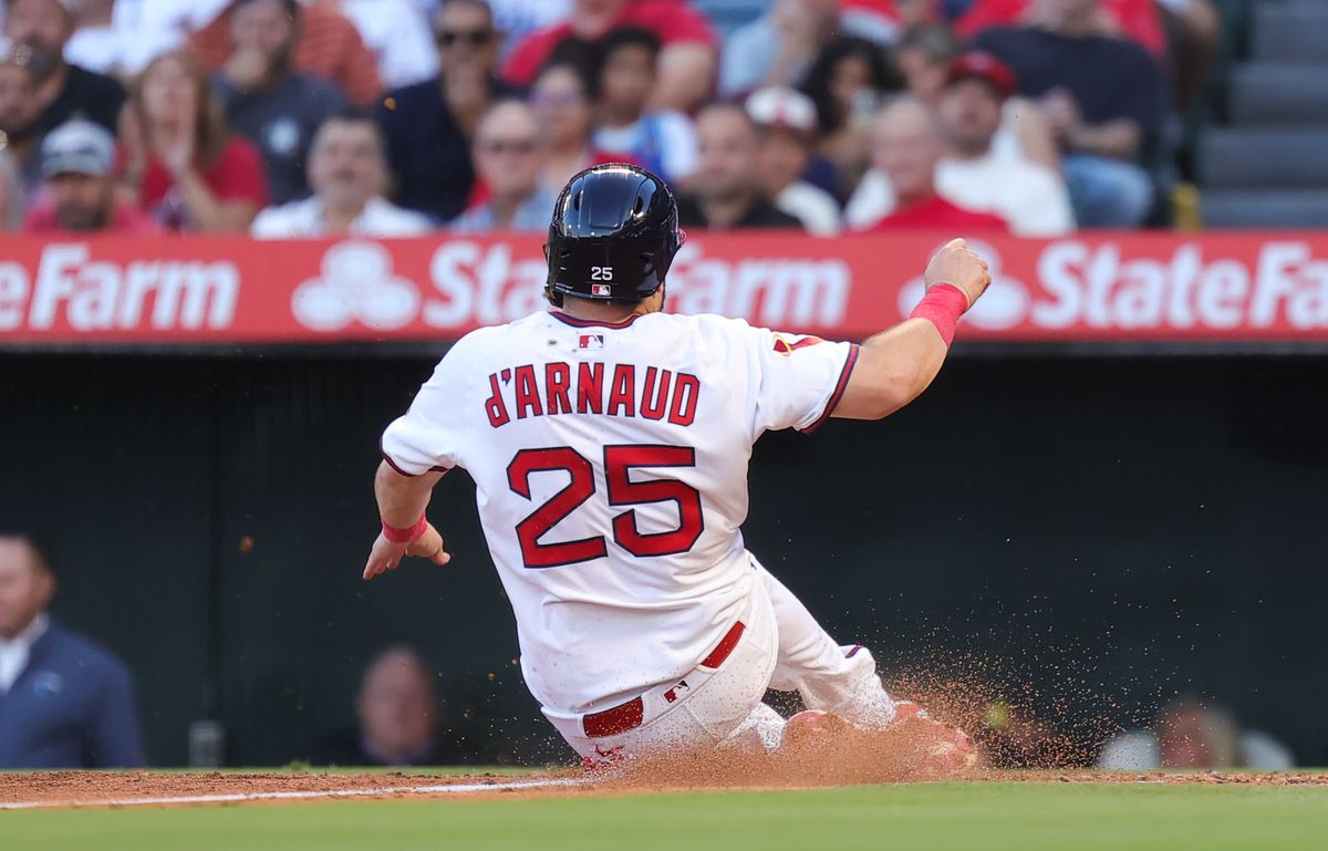 #25 Travis d'Arnaud of the Los Angeles Angels slides home against the Texas Rangers on July 9, 2025 in Anaheim, CA. #25 Travis d'Arnaud of the Los Angeles Angels slides home against the Texas Rangers on July 9, 2025 in Anaheim, CA.