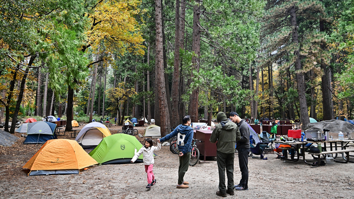 People walk through tents at Yosemite Valley campground in Yosemite National Park, California on Oct. 25, 2025. The national park is one of the best in the United States, according to Travel + Leisure. People walk through tents at Yosemite Valley campground in Yosemite National Park, California on Oct. 25, 2025. The national park is one of the best in the United States, according to Travel + Leisure.