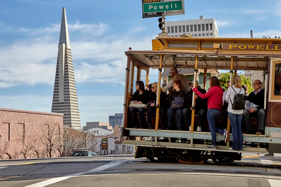 Riding the Cable Car in San Francisco, with views of the Transamerica Pyramid