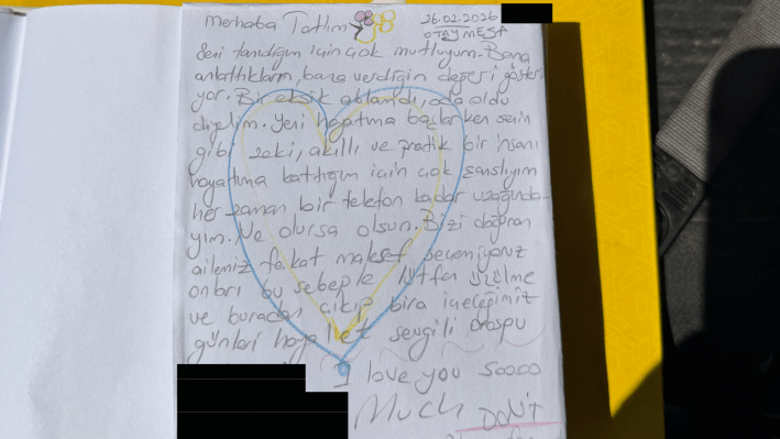a handwritten note in Filipino with a heart on top