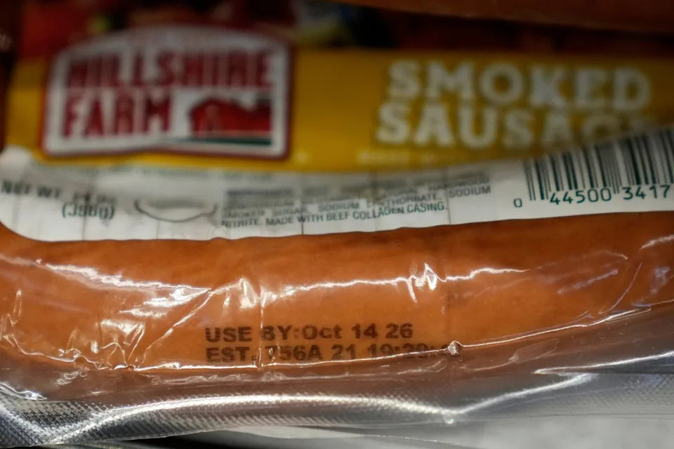 A Use By date is stamped on package of smoke sausage displayed at Park Plaza Fine Foods, Tuesday, June 30, 2026, in San Francisco. (AP Photo/Jeff Chiu) - The Associated Press