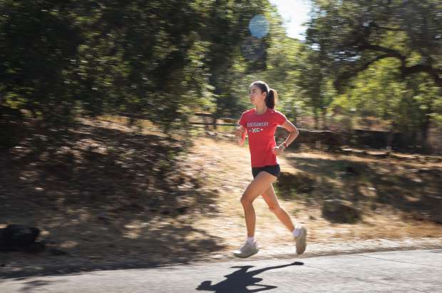 Standout distance runner Hanne Thomsen cruises on a recovery run along Channel Drive in Santa Rosa on Monday, July 28, 2025. Thomsen will be continuing her running career at Stanford University this fall. (Christopher Chung / The Press Democrat)