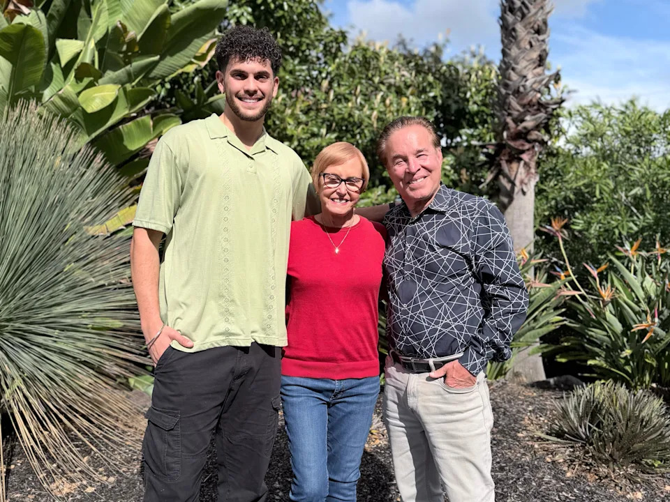 A younger man with an older couple.