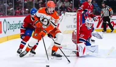 Anaheim Ducks center Leo Carlsson (91) plays the puck around Montreal Canadiens goalie Jacob Fowler (32) net during the second period at Bell Centre.