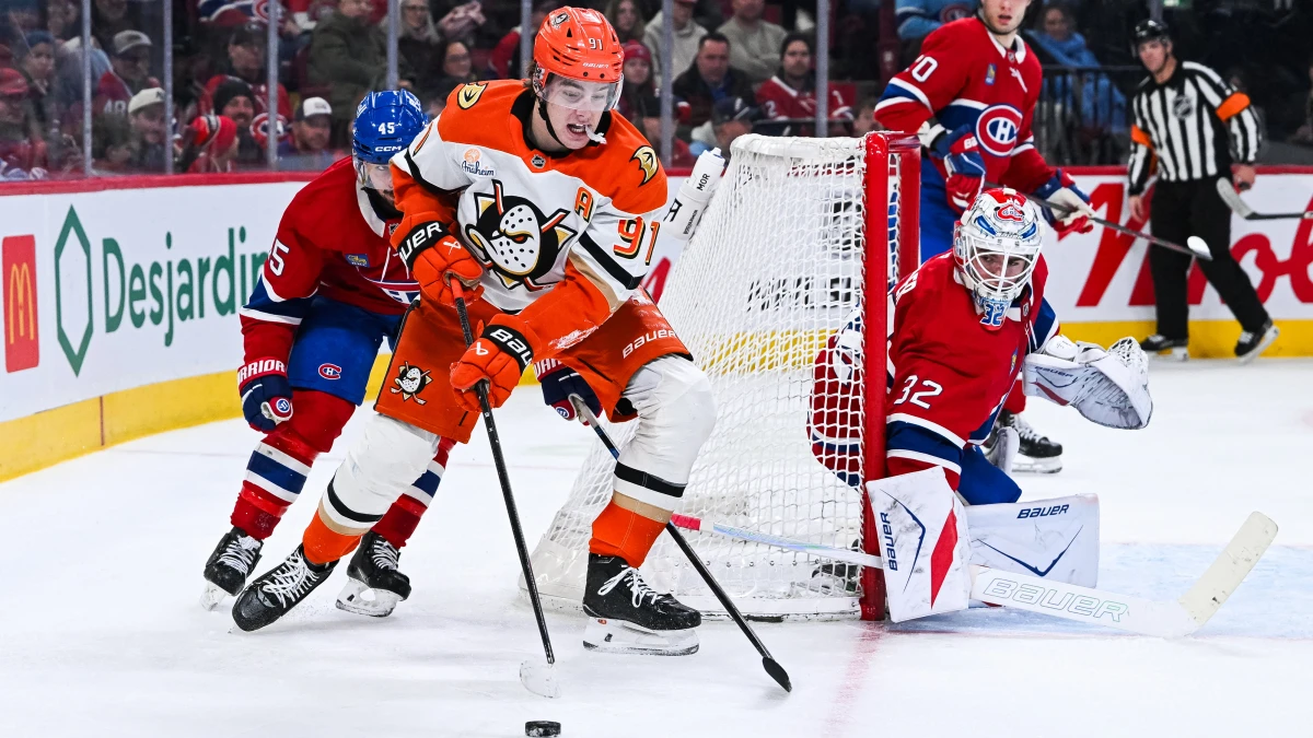 Anaheim Ducks center Leo Carlsson (91) plays the puck around Montreal Canadiens goalie Jacob Fowler (32) net during the second period at Bell Centre.