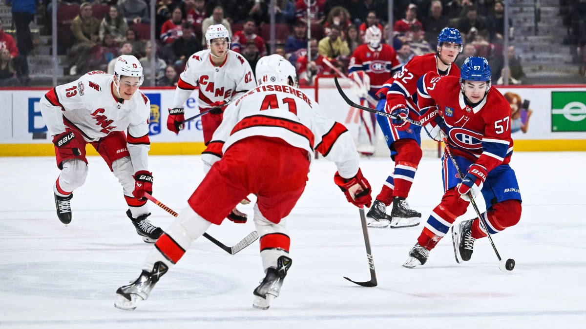 Montreal Canadiens center Sean Farrell (57) plays the puck against Carolina Hurricanes defenseman Shayne Gostisbehere (41) during the first period at Bell Centre.
