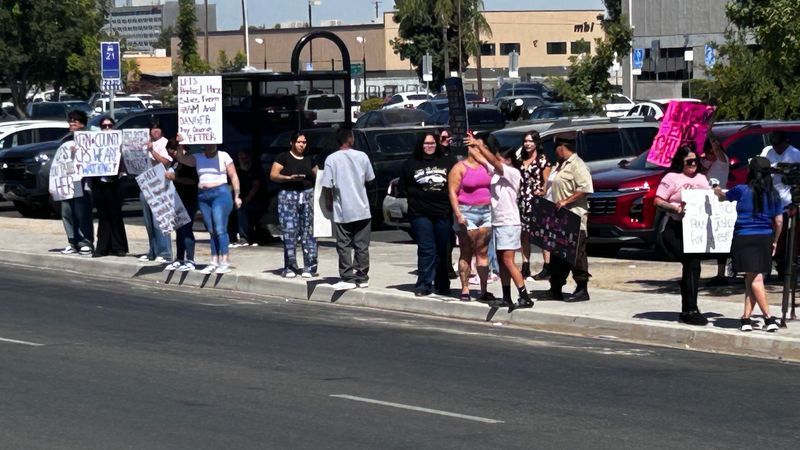 Protest for CPS to be investigated after 8-year-old found dead in a hotel. Protesters rally outside of Kern County Human Services.