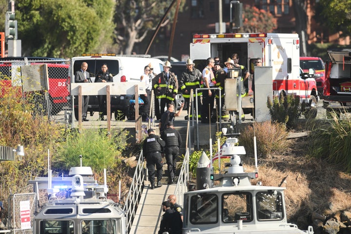 Emergency crews gather at a dock near the site of a pontoon boat incident on Tuesday, July 14, 2026, in San Francisco. (AP Photo/Noah Berger)