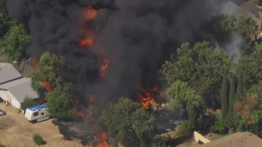 Sacramento fire destroys home, trailer, and belongings, leaving residents stunned