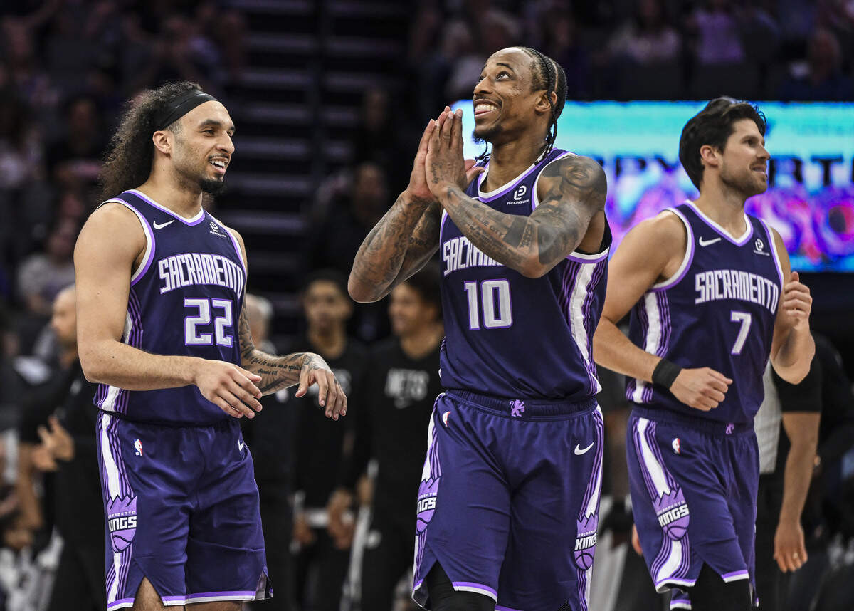 Sacramento Kings guard-forward DeMar DeRozan (10) celebrates a saved ball by teammate guard Devin Carter (22) during the last seconds of the second half at Golden 1 Center in March.