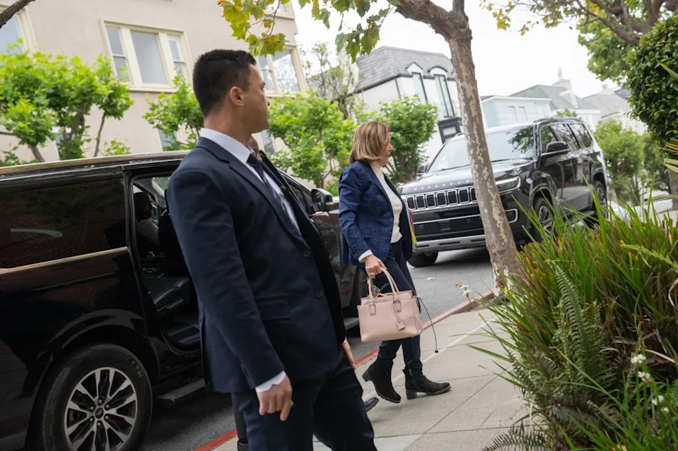 Nancy Pelosi is flanked by her security detail outside the couple’s San Francisco mansion. Minh Connors for CA Post